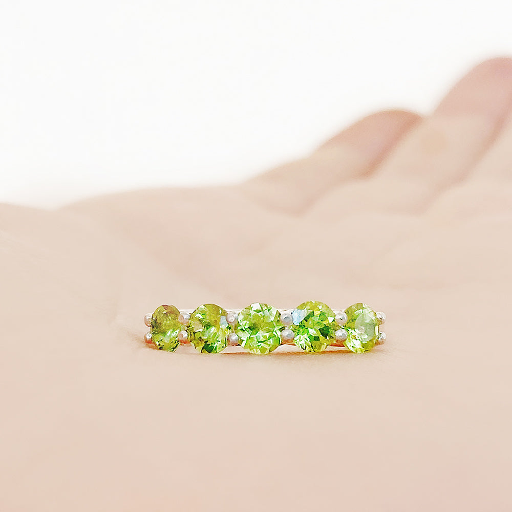 Danelle, a Peridot Half Eternity Trellis Ring