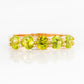 Danelle, a Peridot Half Eternity Trellis Ring