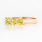 Danelle, a Peridot Half Eternity Trellis Ring