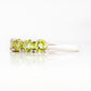 Annie, a Peridot Half Eternity Ring