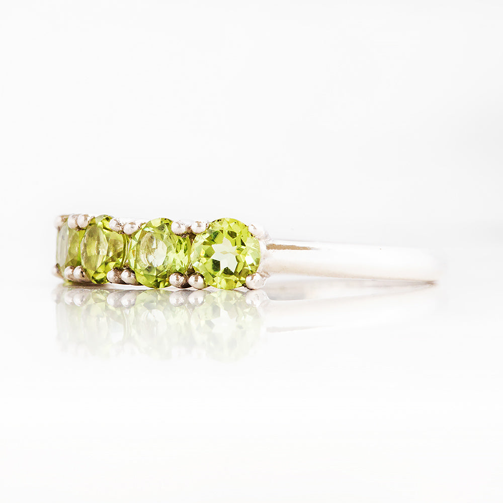 Annie, a Peridot Half Eternity Ring