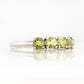 Annie, a Peridot Half Eternity Ring