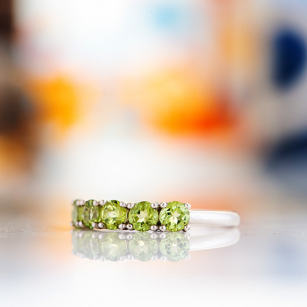 Annie, a Peridot Half Eternity Ring