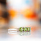 Annie, a Peridot Half Eternity Ring