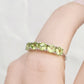 Annie, a Peridot Half Eternity Ring
