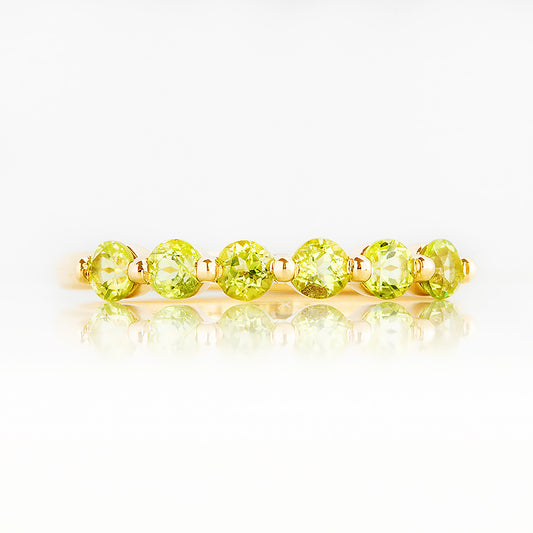 Ellie, a Peridot Six Stone Half Eternity Ring