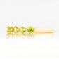 Ellie, a Peridot Six Stone Half Eternity Ring
