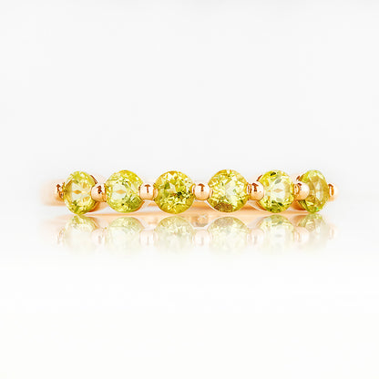 Ellie, a Peridot Six Stone Half Eternity Ring