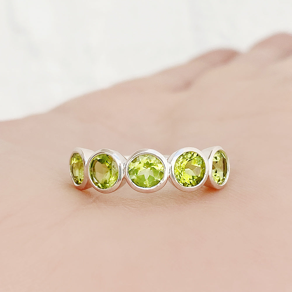 Chie, a Peridot Half Eternity Ring