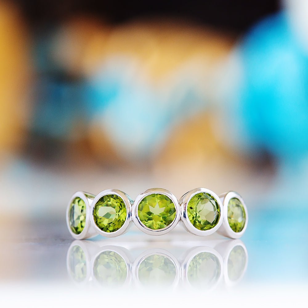 Chie, a Peridot Half Eternity Ring