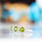 Chie, a Peridot Half Eternity Ring