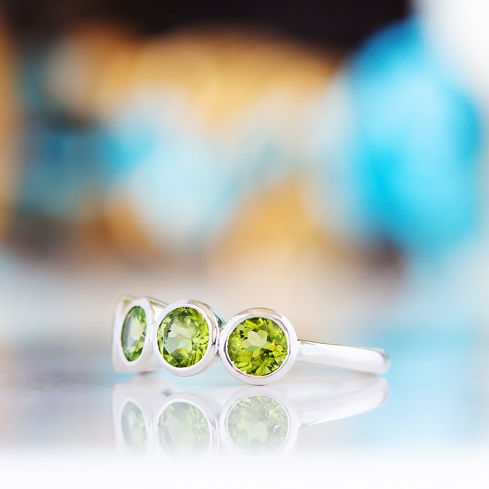 Chie, a Peridot Half Eternity Ring