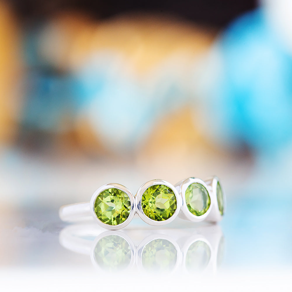 Chie, a Peridot Half Eternity Ring