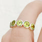 Chie, a Peridot Half Eternity Ring