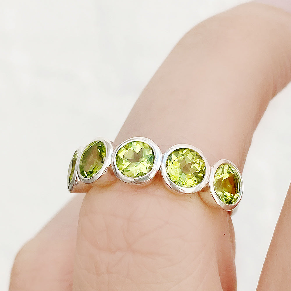 Chie, a Peridot Half Eternity Ring
