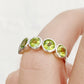 Chie, a Peridot Half Eternity Ring