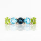 Annie, a Peridot and Topaz Half Eternity Ring