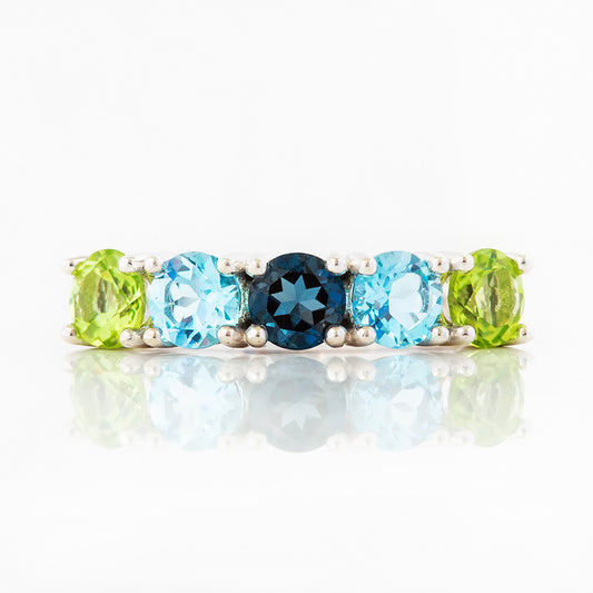 Annie, a Peridot and Topaz Half Eternity Ring