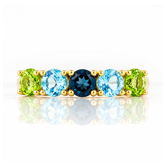 Annie, a Peridot and Topaz Half Eternity Ring