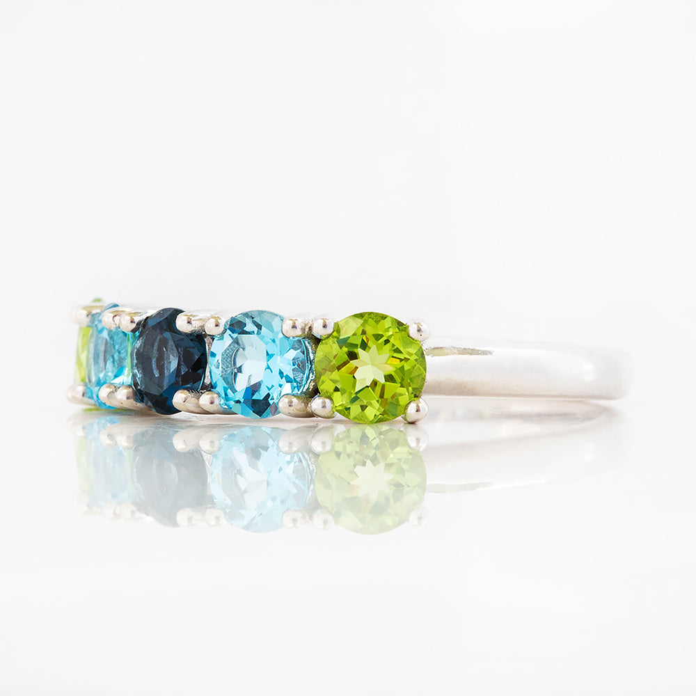 Annie, a Peridot and Topaz Half Eternity Ring