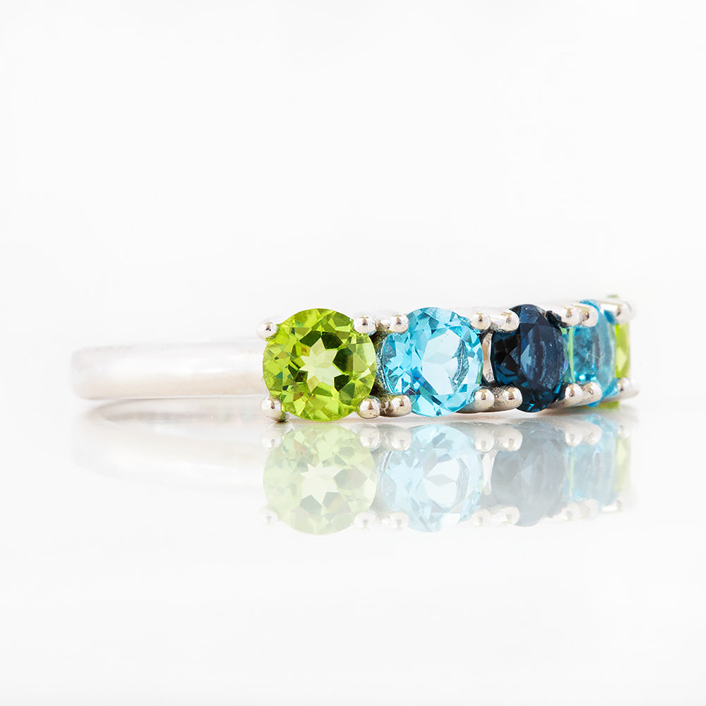Annie, a Peridot and Topaz Half Eternity Ring