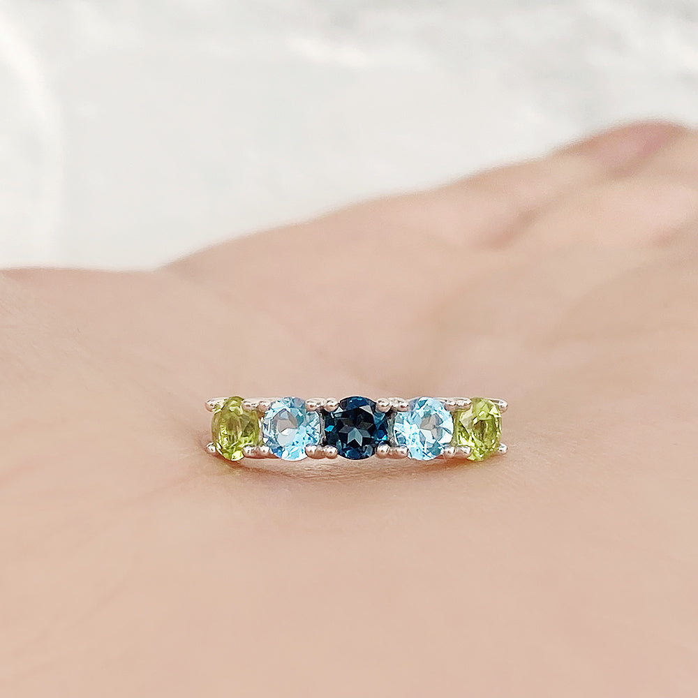 Annie, a Peridot and Topaz Half Eternity Ring