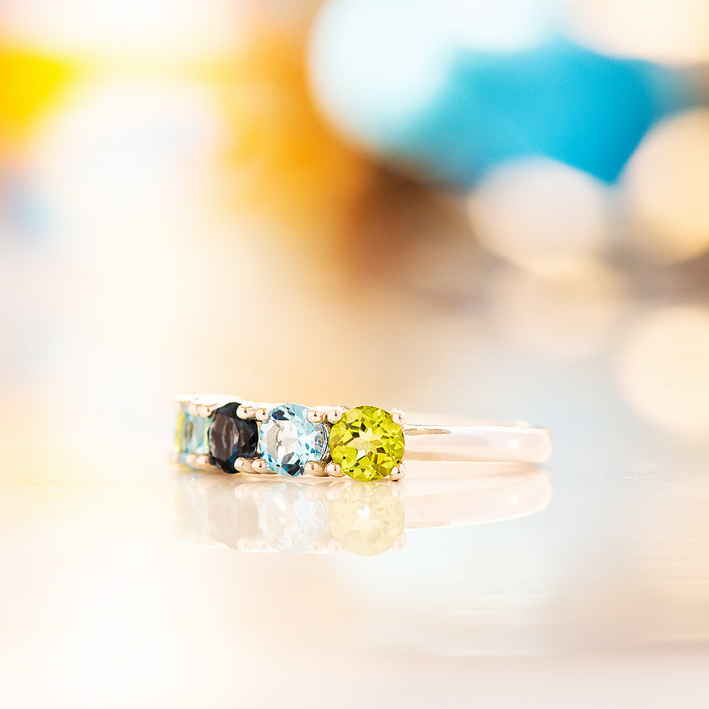 Annie, a Peridot and Topaz Half Eternity Ring