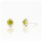 round cut green peridot stud earrings in a sterling silver bezel tube setting