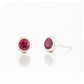 round cut pinkish red rhodolite stud earrings in a sterling silver bezel tube setting