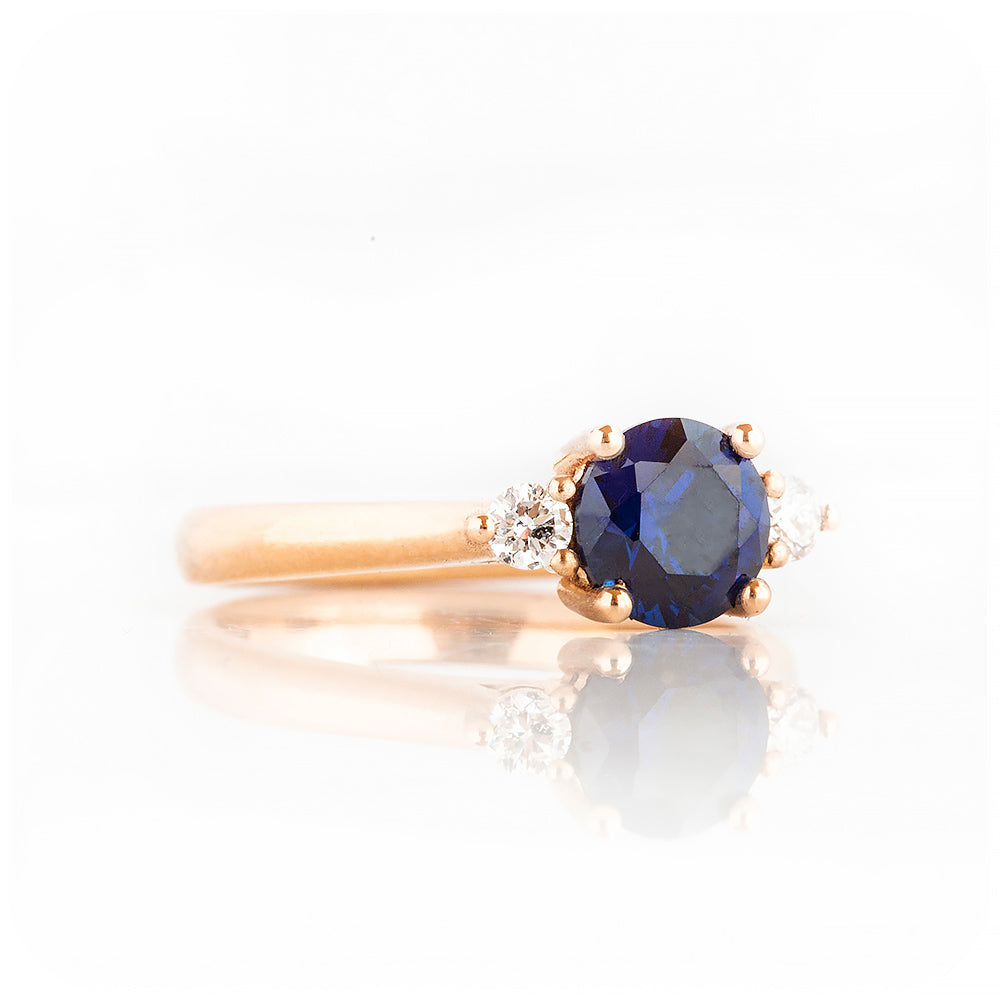 Round cut Lab Sapphire and Diamond Trilogy Engagement Ring in Rose Gold - Victoria's Jewellery