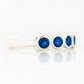 Violet, a Lab Sapphire Bezel Set Half Eternity Ring