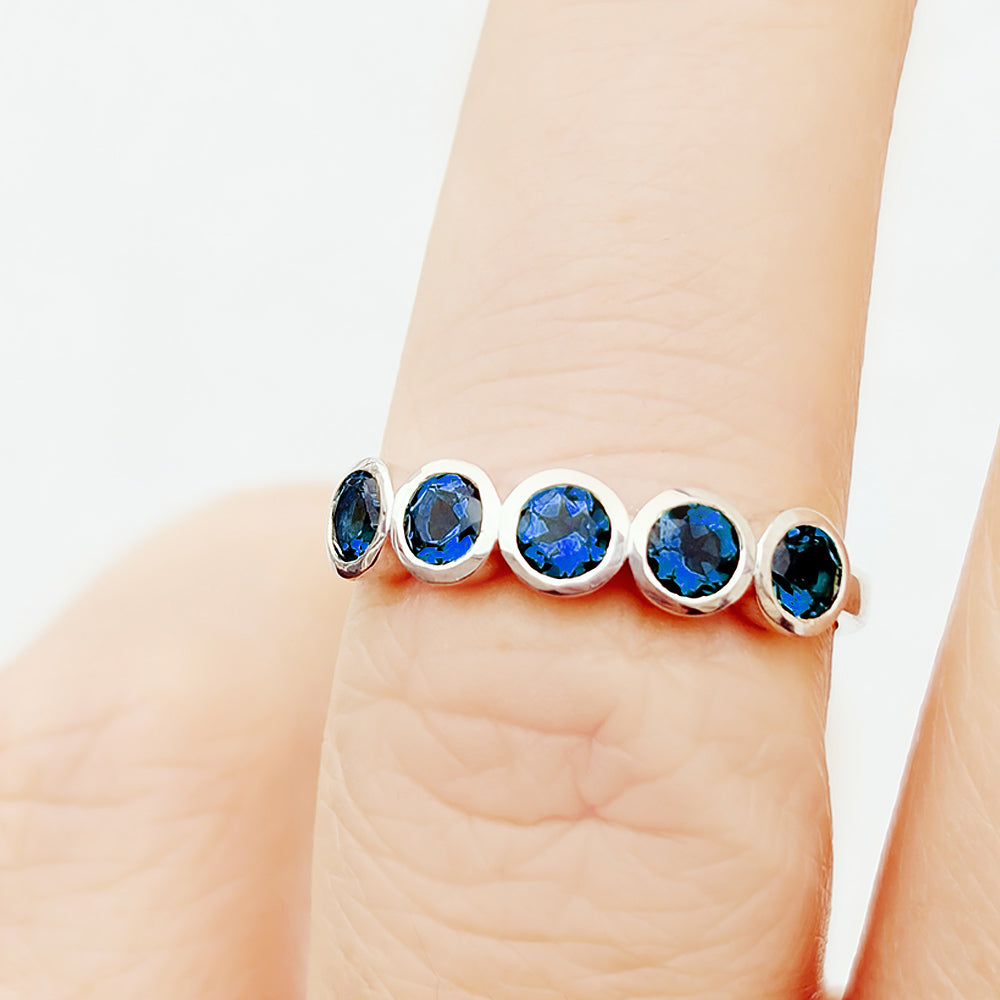 Violet, a Lab Sapphire Bezel Set Half Eternity Ring