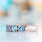 Celine, a Sky Blue Topaz Four Stone Half Eternity Ring