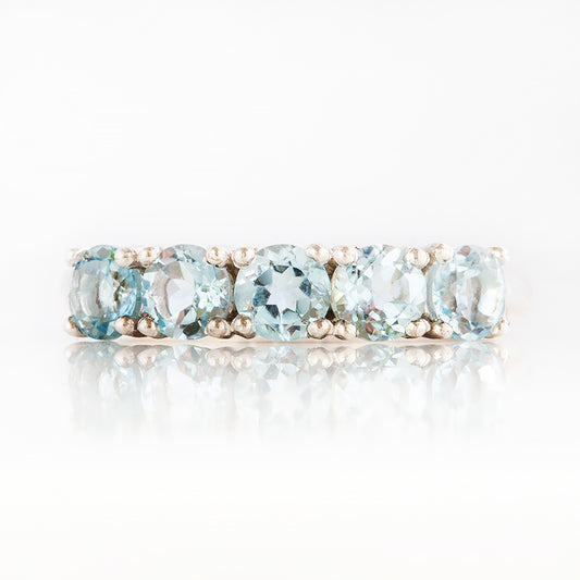 Annie, a Sky Blue Topaz Half Eternity Ring