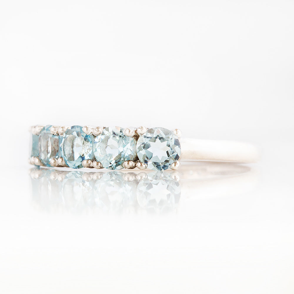 Annie, a Sky Blue Topaz Half Eternity Ring