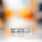 Annie, a Sky Blue Topaz Half Eternity Ring