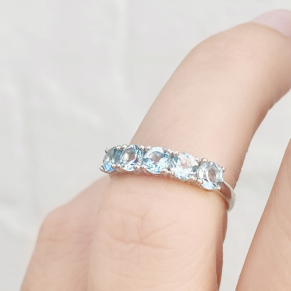 Annie, a Sky Blue Topaz Half Eternity Ring