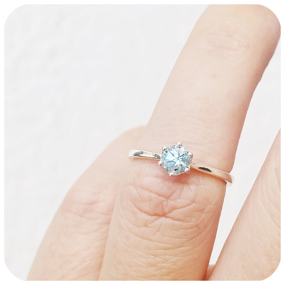 Tulip, a Six Claw Sky Blue Topaz Ring