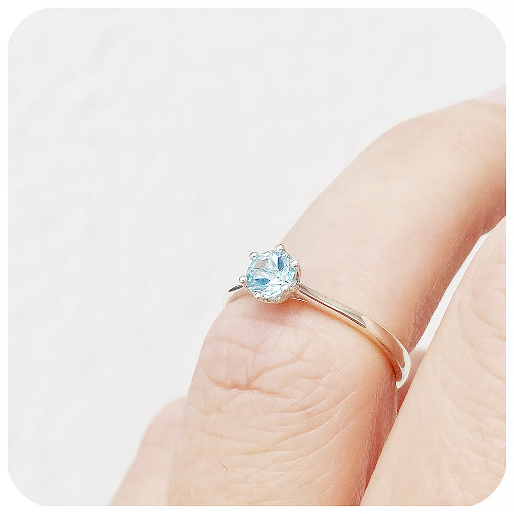 Tulip, a Six Claw Sky Blue Topaz Ring