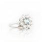 Fleur, a Moissanite and Topaz Flower Cluster Ring