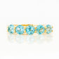 Danelle, a Swiss Blue Topaz Half Eternity Trellis Ring