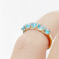 Danelle, a Swiss Blue Topaz Half Eternity Trellis Ring