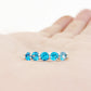 Danelle, a Swiss Blue Topaz Half Eternity Trellis Ring