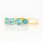 Danelle, a Swiss Blue Topaz Half Eternity Trellis Ring