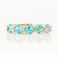 Danelle, a Swiss Blue Topaz Half Eternity Trellis Ring