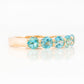 Danelle, a Swiss Blue Topaz Half Eternity Trellis Ring