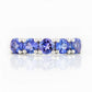 Round cut Tanzanite half eternity December Anniversary Ring in White Gold - Victoria's Jewellery