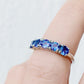 Round cut Tanzanite half eternity December Anniversary Ring in White Gold - Victoria's Jewellery