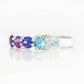Danelle, a Blue Half Eternity Trellis Ring