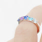 Danelle, a Blue Half Eternity Trellis Ring
